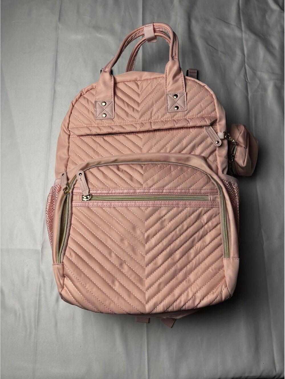 Light Pink Quilted Backpack with Multiple Compartments and Mesh Side Pockets